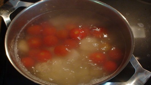 Tomatoes into boiling water