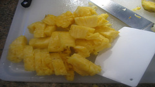 Slice the pineapple