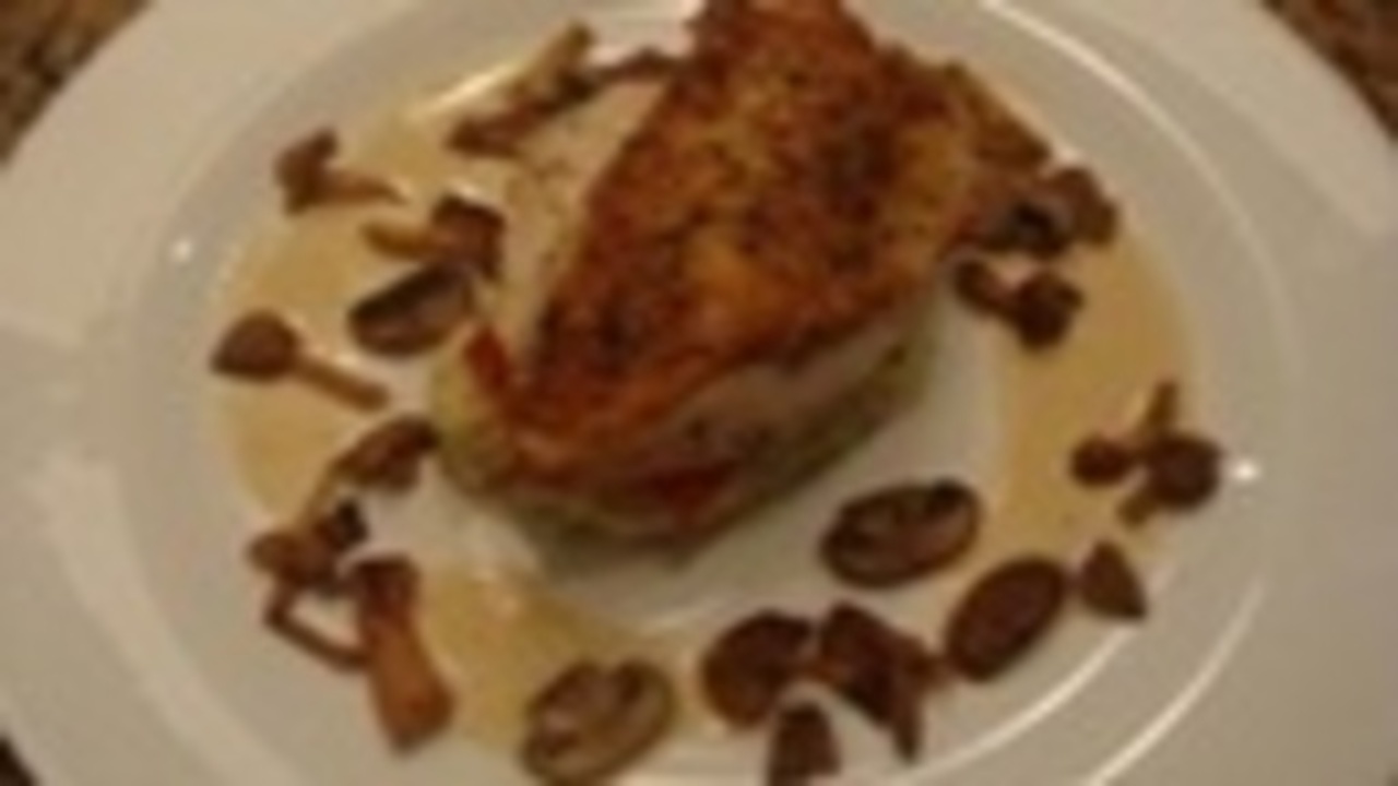 Chicken Royale On Basil Mashed Potatoes with wild mushrooms and Porcini Cream