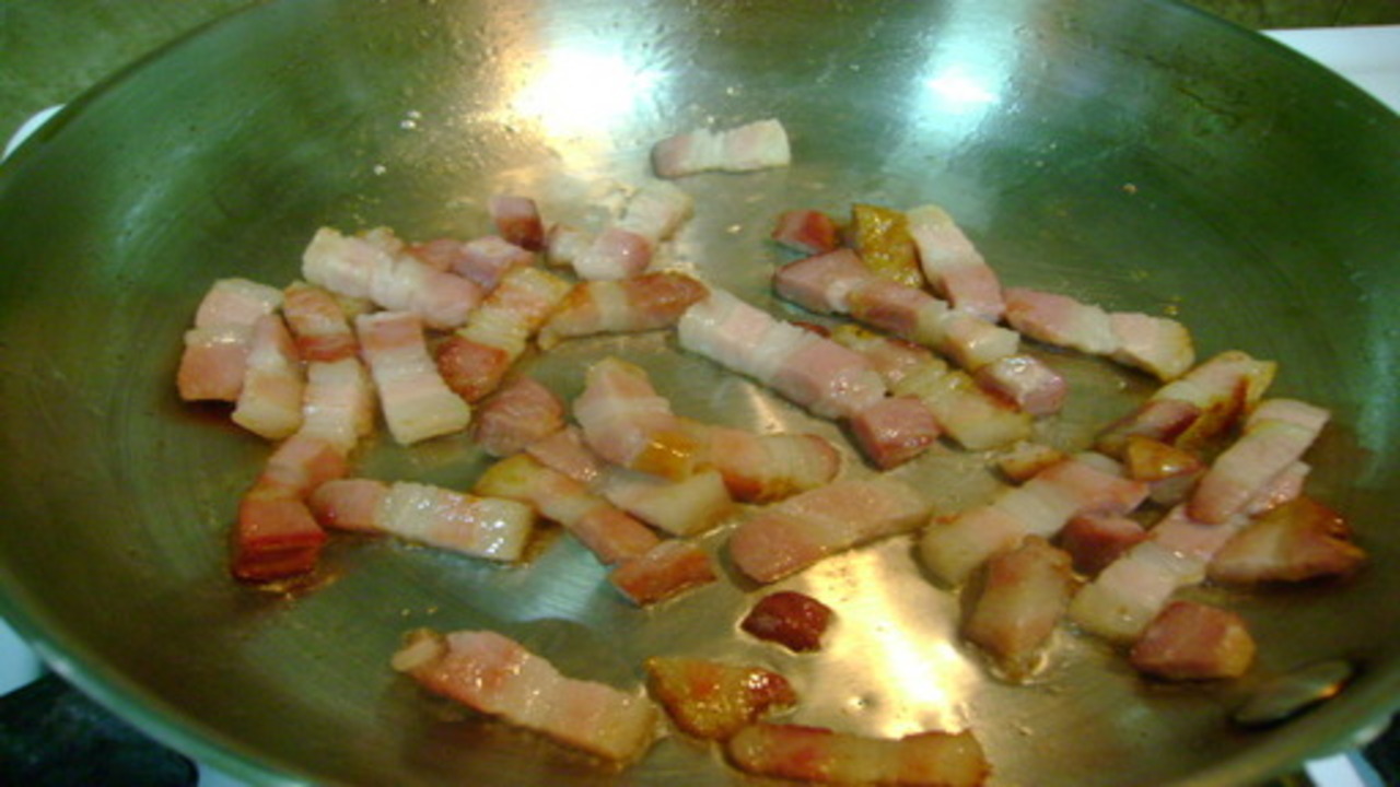 Cooking the bacon and scraping the pumpkin