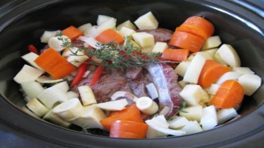 Slow cooking the dish.