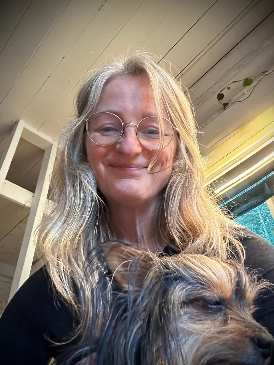Dawn Thomas smiling with her dog